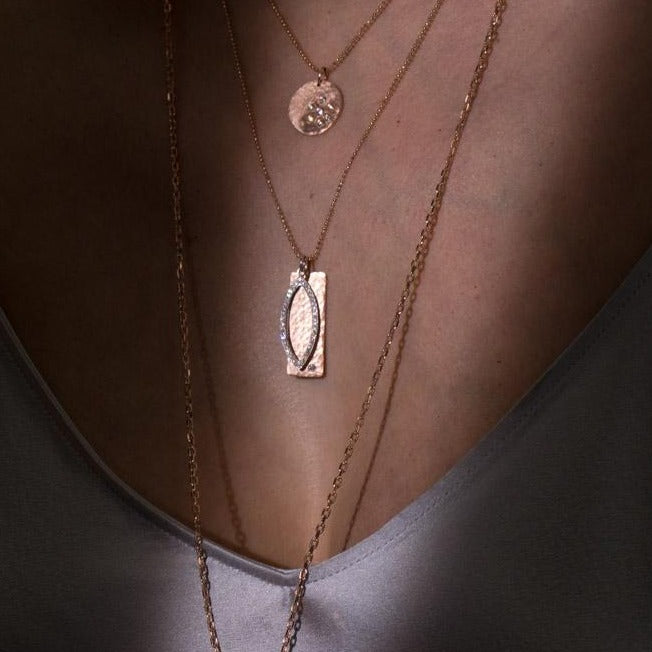 14k gold medium NIKI bar pendant with small EDIE diamond eye pendant on model