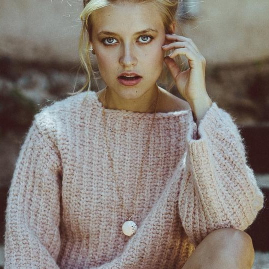 14k gold x-large MINA medallion with scattered diamonds on model