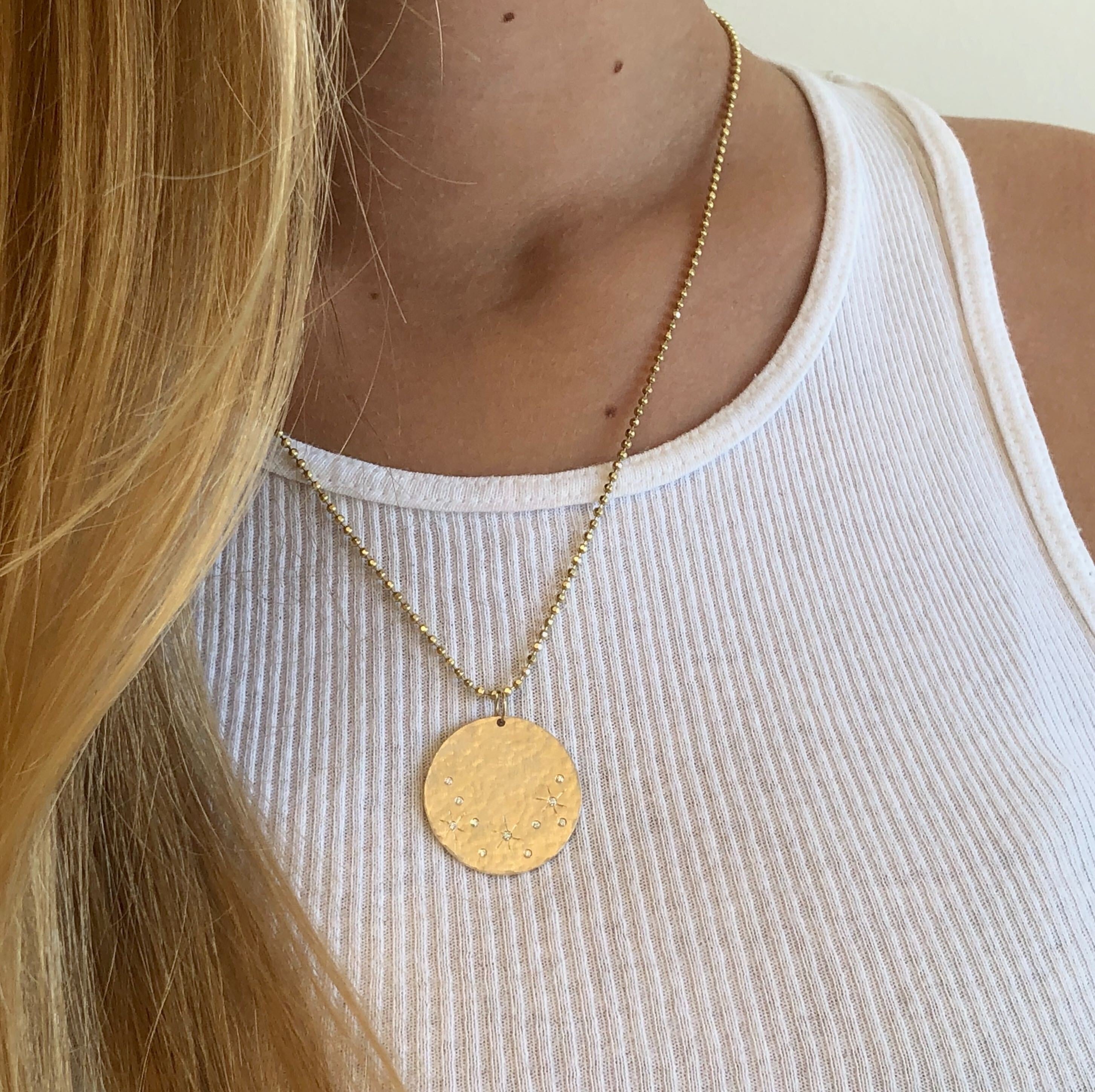 14k yellow gold x-large MINY medallion with diamond and etching on model