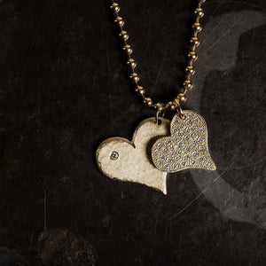 14k gold large LANA and medium LAVA heart pendants layered in lookbook image