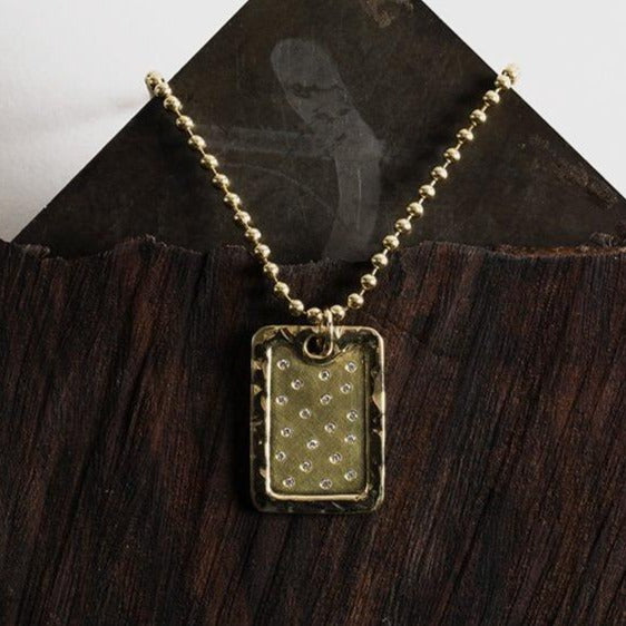 14k gold x-large DANI dog tag pendant with scattered diamonds in lookbook image