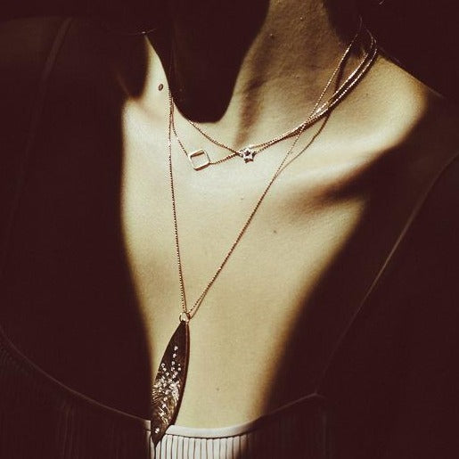 14k gold PESH necklace on model