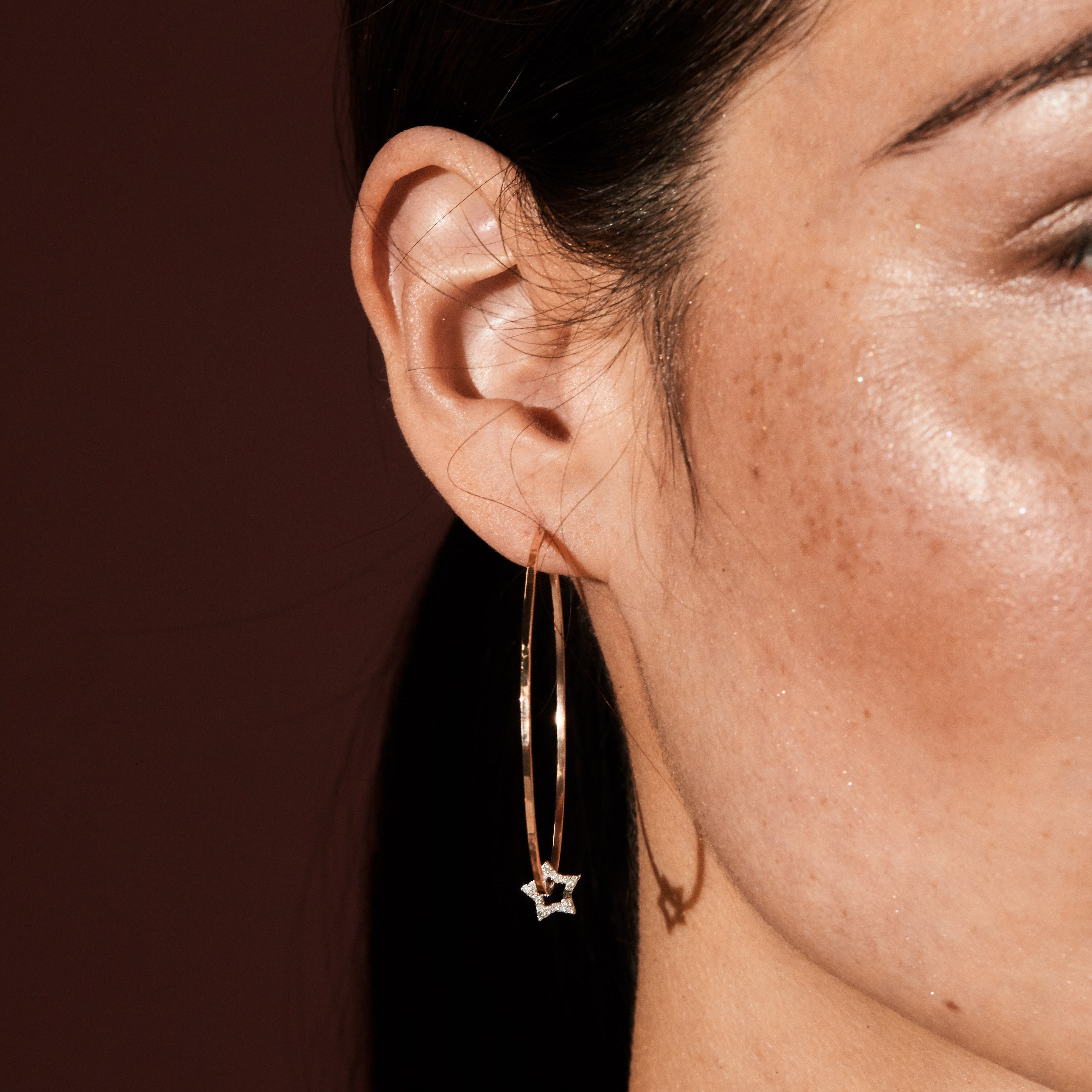 14k white gold STAR charms for ORMS hoop earrings on a model