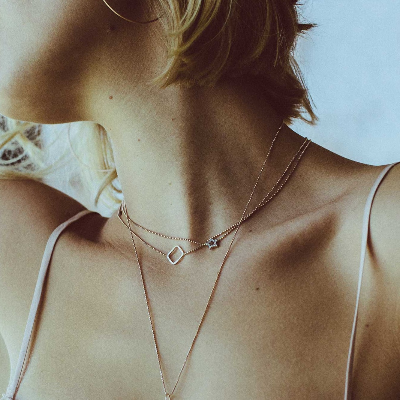 14k gold PESH necklace on model