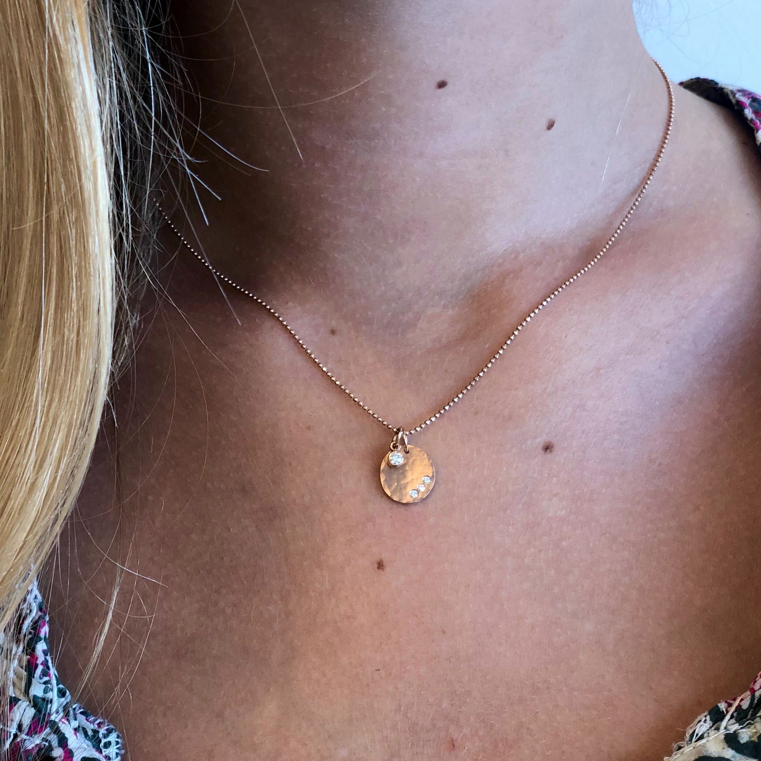 14k gold SAGE baby with BEZI charm on model