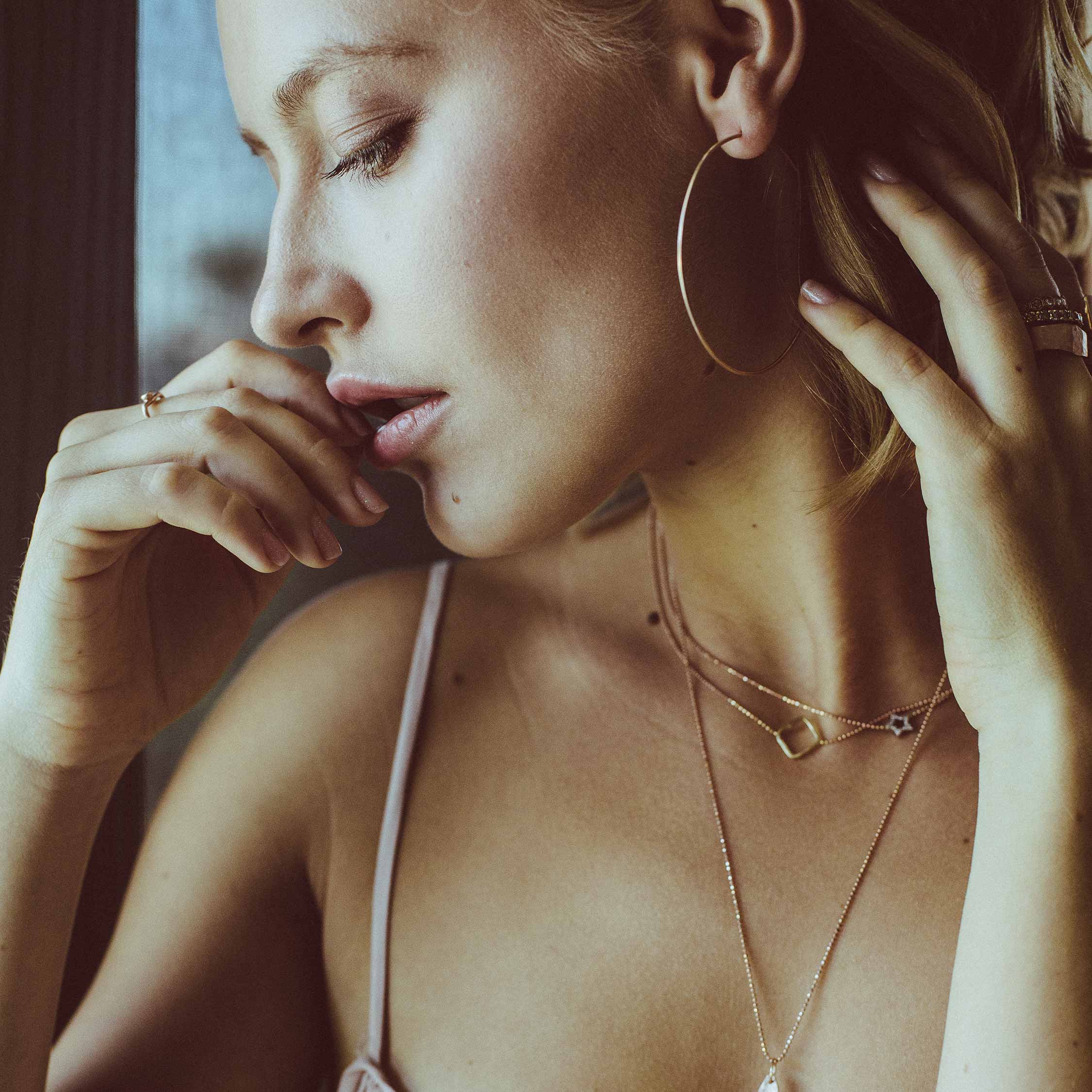 14k gold STAR necklace with PESH on model