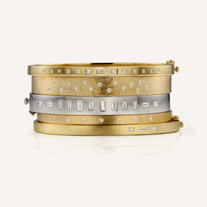 18k yellow gold TUMI hinged cuff bracelet with mixed white diamonds stacked with SIMI, TING and BOLA bracelets