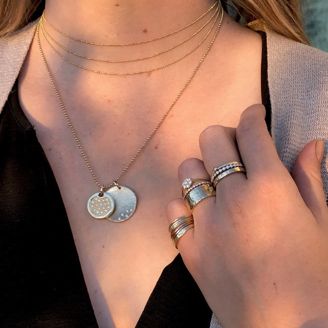 14k gold RAYA ring on model