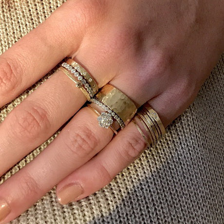 14k gold GALA ring layered with other rings