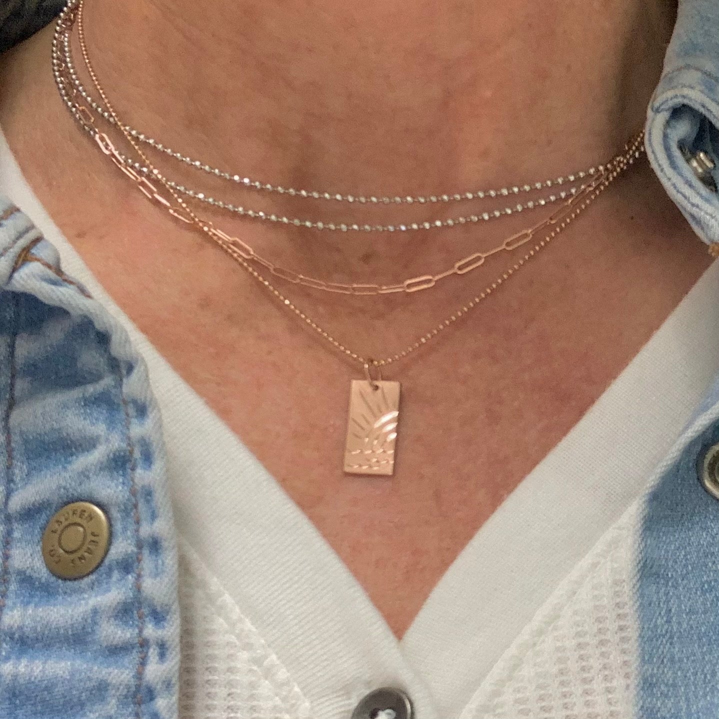 14k gold COCU etched ocean charm on model