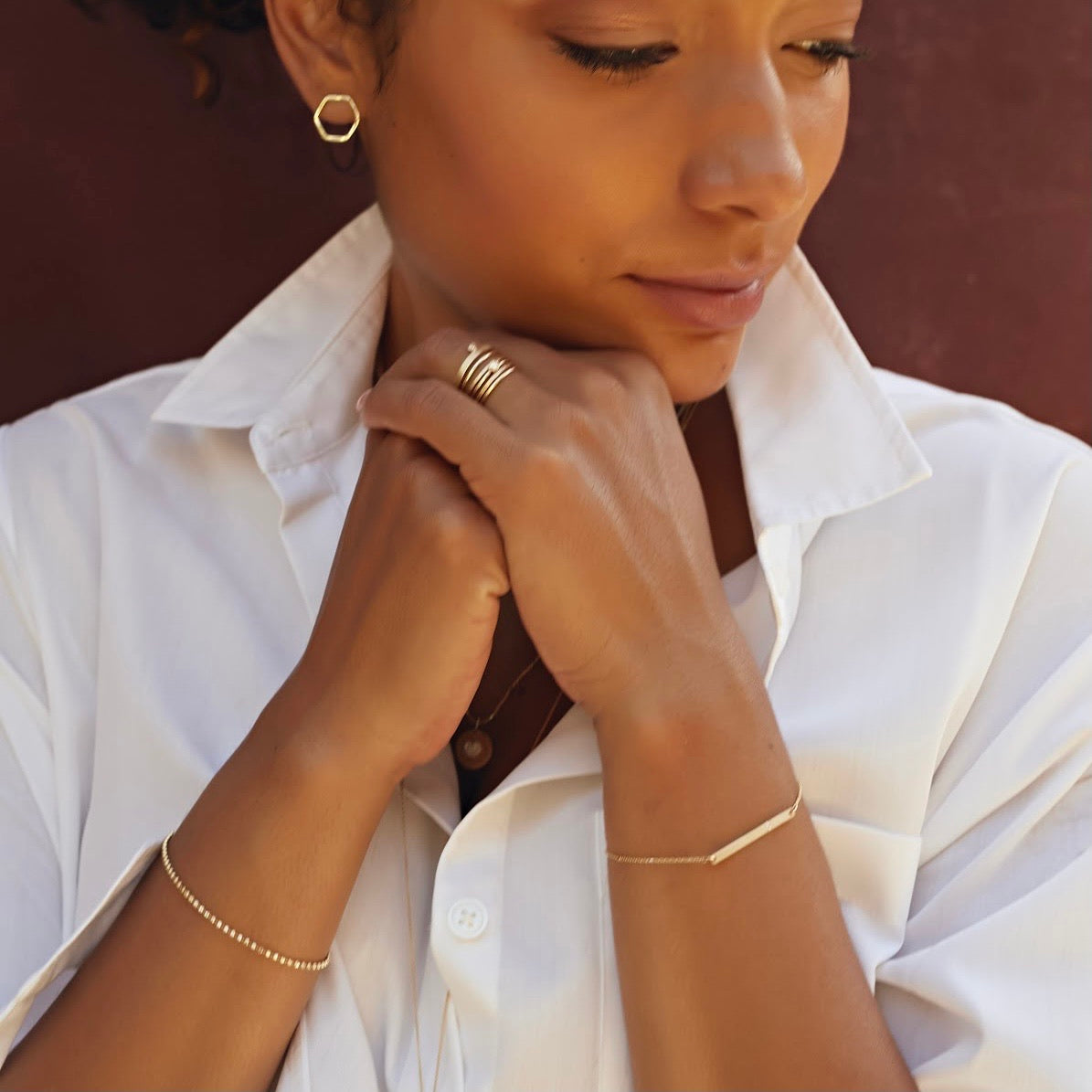 14k gold GOUL earrings on model