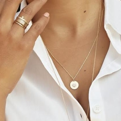 14k gold GOZA charm on model