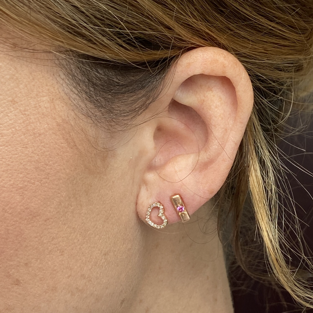 14k gold LARA diamond heart post earrings on model